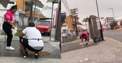 Taqueros recogiendo barbacoa del piso