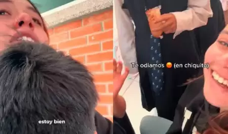 Alumnos consuelan a maestra