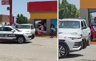 Mujer resulta con lesiones al ser prensada por un auto contra cristal de una tienda
