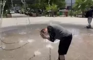 Calor extremo lleva a joven de Cananea a refrescarse en fuente del Jard�n Ju�rez